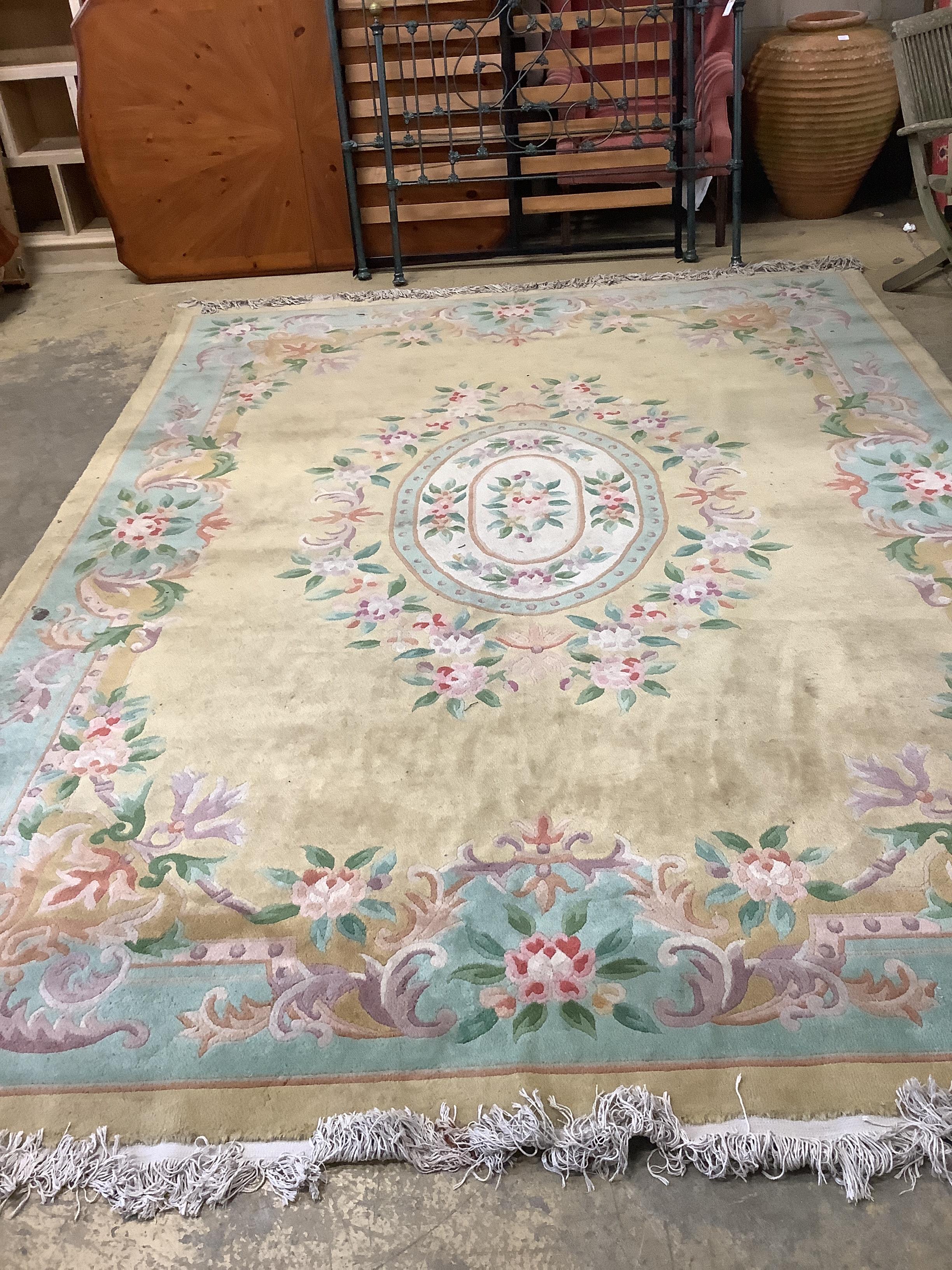A Chinese gold ground carpet, 360 x 270cm